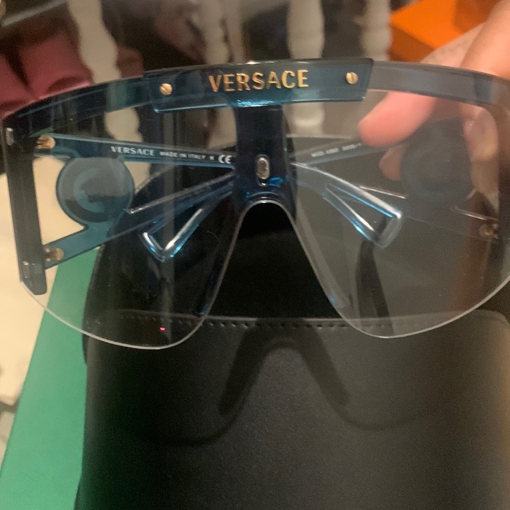 Authentic Versace sunglasses comes with changing lenses and glass case